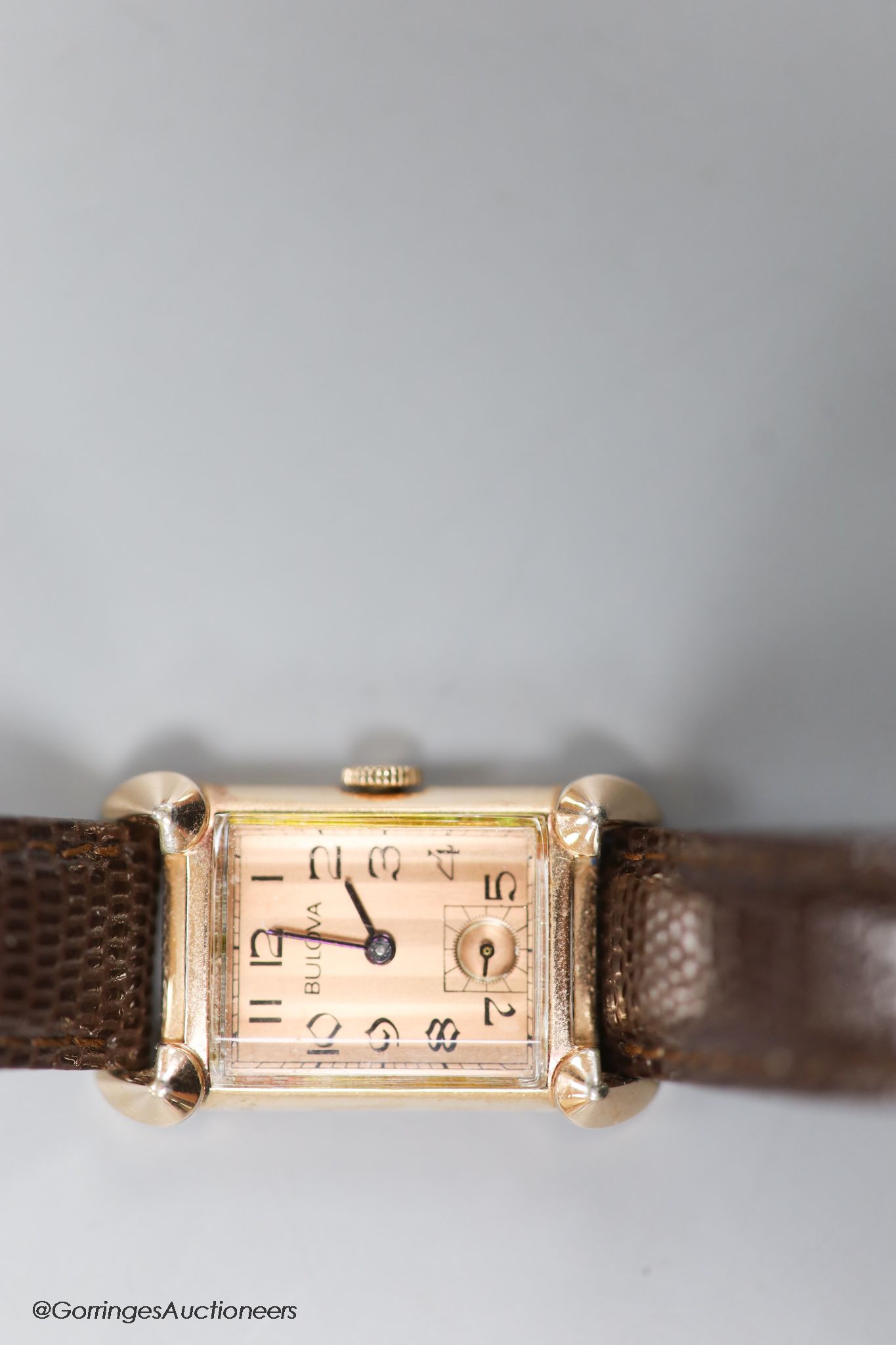 A gentleman's 1930's 14k gold filled Bulova manual wind rectangular dial wrist watch, with subsidiary seconds, on later leather strap.